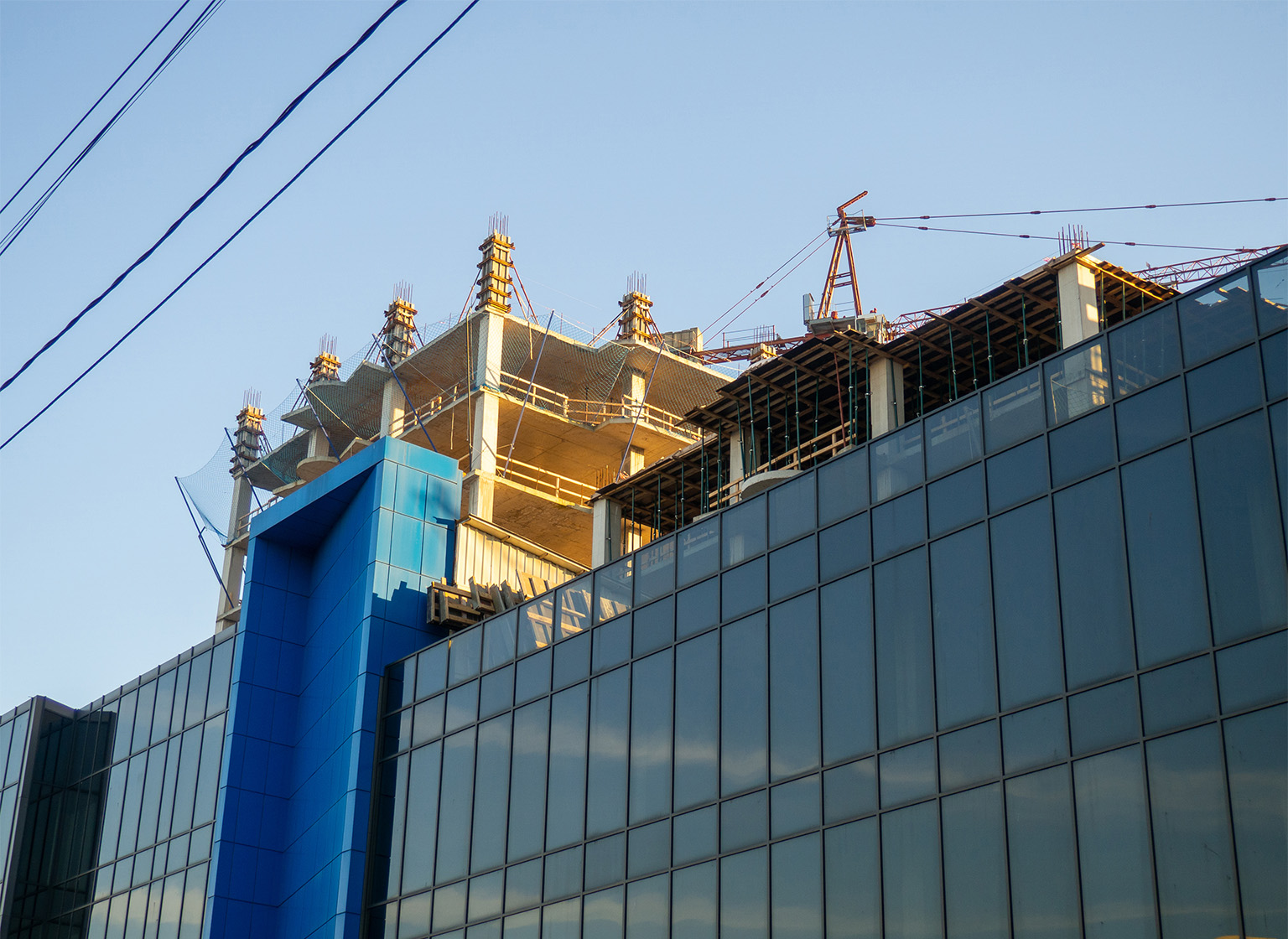 Commercial construction services in Eastern MI Construction of houses in a modern city. Construction of high-rise buildings. Construction concept. City center.